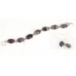 An amethyst bracelet and earrings, the oval stones mounted in 925 stamped silver (2)