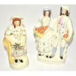 Two Victorian Staffordshire figures of market sellers, one marked 'Orange Sellers', height 36.5cm (