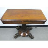 A William IV rosewood card table swivel action fold over top fitted to the inside with a circular