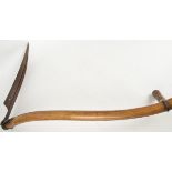 A Western Scythe, the blade measuring 52cm, length 151cm