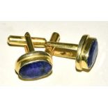 A pair of faceted sapphire cufflinks, in oval gilt mounts