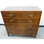 A Regency mahogany veneered chest, two short over three long graduated drawers, swept apron,