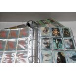 Star Wars trade cards, two albums containing various sets and part sets of Star Wars cards,