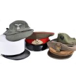 An assortment of overseas caps and hats, including Foreign Legion, German Third Reich, Russian and