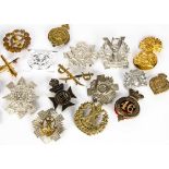 A small group of Scottish Cap badges, including 1st VB (Glasgow) Highland Light Infantry, Highland