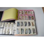 Two albums of 30 complete sets, all transport related, including five modern cigar issues,