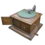 A hornless gramophone, HMV Model 1, in oak case with HMV Exhibition soundbox (gaskets hard),supplied