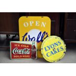 A vintage Lyons Cakes circular enamel sign, together with a Coca-Cola sign and a Walls Ice Cream
