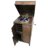 A cabinet gramophone, HMV Model 192, with No 4 soundbox and 'saxophone' internal horn, oak case with