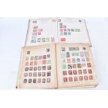 Two vintage stamp albums, one better populated with 19th and 20th Century world stamps, the other