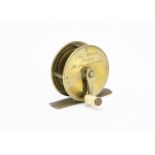 A Chas Farlow 2¼" brass fishing reel, with maker name and address '191 Strand, London' to side,