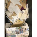 Three boxes of loose stamps and envelopes