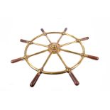 A Brown Bros & Co Ltd brass and wood ship's wheel, the brass wheel with maker's name to the