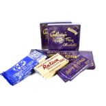 An assortment of chocolates and chocolate bars, all with 1945 design, including Milk Tray,