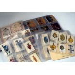 A box full of various silk issues, including Flags, badges etc