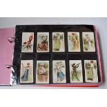An album of overseas cigarette cards, to include 48/50 BAT Teal Film Stars, 23 BAT Sporting Girls,