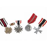 A group of Third Reich medals, comprising the Eastern Front medal, the War Merit Cross without