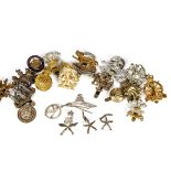 A collection of various cap badges and buttons, to include, white metal cufflinks and pin badges for