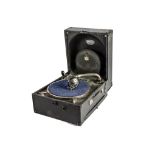 A portable gramophone, Decca 66, with replacement soundbox, internal horn connecting to lid,