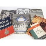 A collection of military related books and ephemera, to include First Day Covers, a book of Burma,