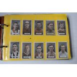 An album of mainly Sporting cards, including 108 BAT Famous Footballers 1st - 3rd Series, complete