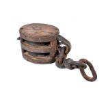 An antique ship's pulley, complete with small length of chain, body 22cm