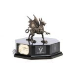 A presentation trophy, with white metal Welsh Dragon on octagonal base, silver hallmarked plaque