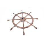 A solid bronze ship's wheel, the unmarked wheel with eight handles, of which one being set at a