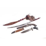 Three African/Middle Eastern items, to include a knife, a longer bladed weapon and a pistol (3)