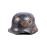 A WWI German M16 helmet, with liner, in camo finish, no obvious marking to the inside or the liner