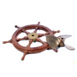 A reproduction ship's wheel, 62cm diameter, including handles, together with a small boats three
