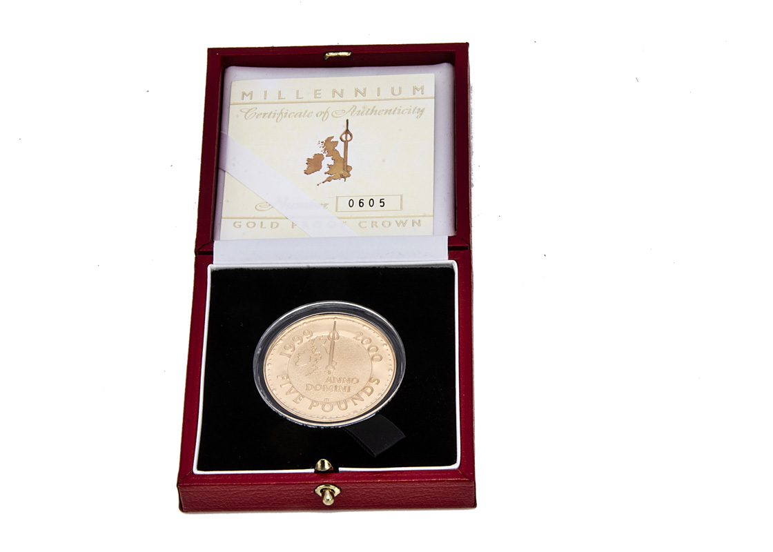 A modern Royal Mint Millenium Gold Proof Crown coin, in fitted box with certificate 0605, approx