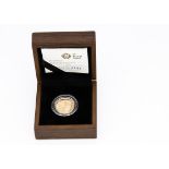A modern Royal Mint The 2009 UK Shield of the Royal Arms £1 Gold Proof Coin, in fitted box with