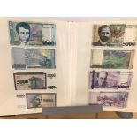A folder of World bank notes, including examples from Brazil, Armenia, Georgia, Azerbaijan,