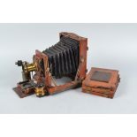 A Houghtons Empress Field Camera, 6½ x 4¾in, focusing screen broken, 'Empress' plate present,