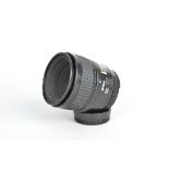A Nikon AF Micro Nikkor 60mm f/2.8D Lens, serial no 3033826, auto focus functions, barrel G, some
