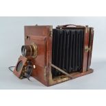 A Gandolfi Universal Tailboard Whole Plate Camera, circa 1910, dark brown parallel bellows, screen