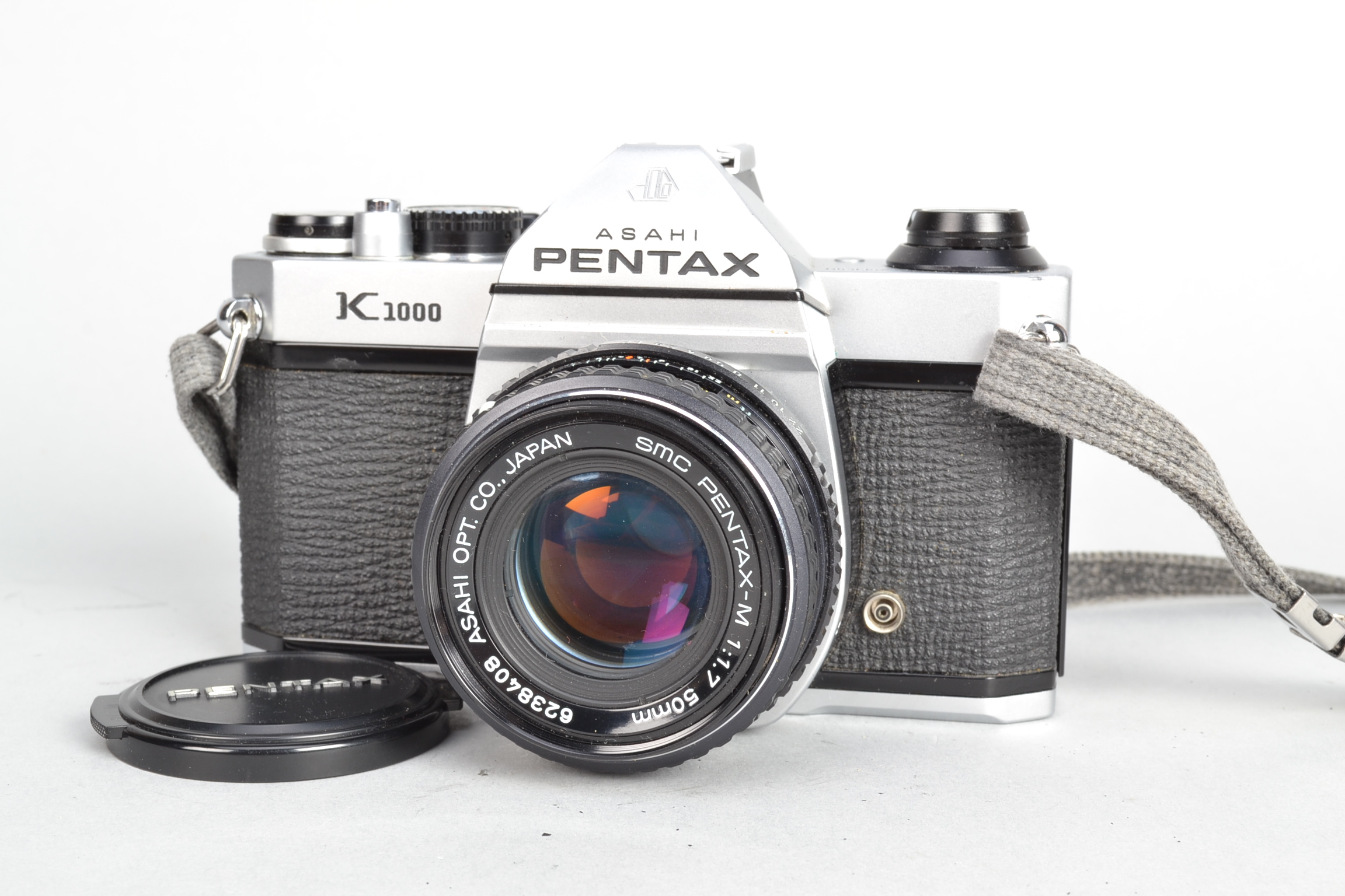 An Asahi Pentax K1000 Camera, serial no 7560381, shutter working, meter responsive, body G, light