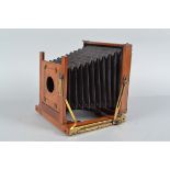 A Half Plate Mahogany Field Camera Body, unnamed, square-cornered tapered black bellows, double