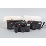 Two Leica AF-C1 Cameras, both power up, otherwise untested, one in soft case, other in maker's