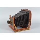 A Half Plate Mahogany Field Camera, unnamed, square-cornered tapered black bellows, double