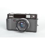 A Konica Hexar Camera, black, serial no 0016896, powers up, appears to function as should, shutter