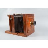 A Liesegang 18 x 18cm Mahogany Tailboard Camera, square-cornered parallel bellows, maker's plate