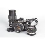 An Olympus OM2n Camera, black, serial no 1059132, body G, light scratches, light wear around strap