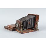 A Lancaster Special Instantograph Tailboard Quarter-Plate Camera, square-cornered black bellows,