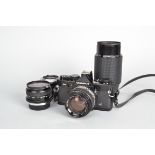 An Olympus OM2 MD Camera Outfit, black, serial no 390735, shutter working, meter responsive, timer