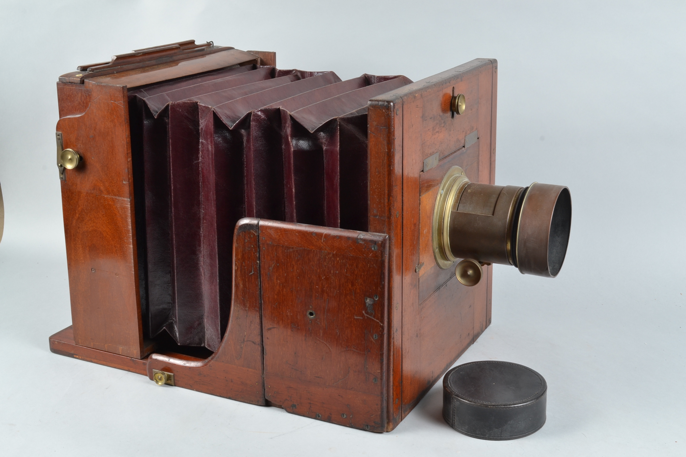 A Large Mahogany Tailboard Camera, 12 x 12in, square cornered, straight maroon bellows, no