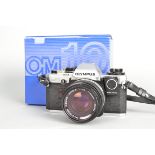 An Olympus OM10 Camera, serial no 1807559, shutter working, meter responsive, chrome,with maual