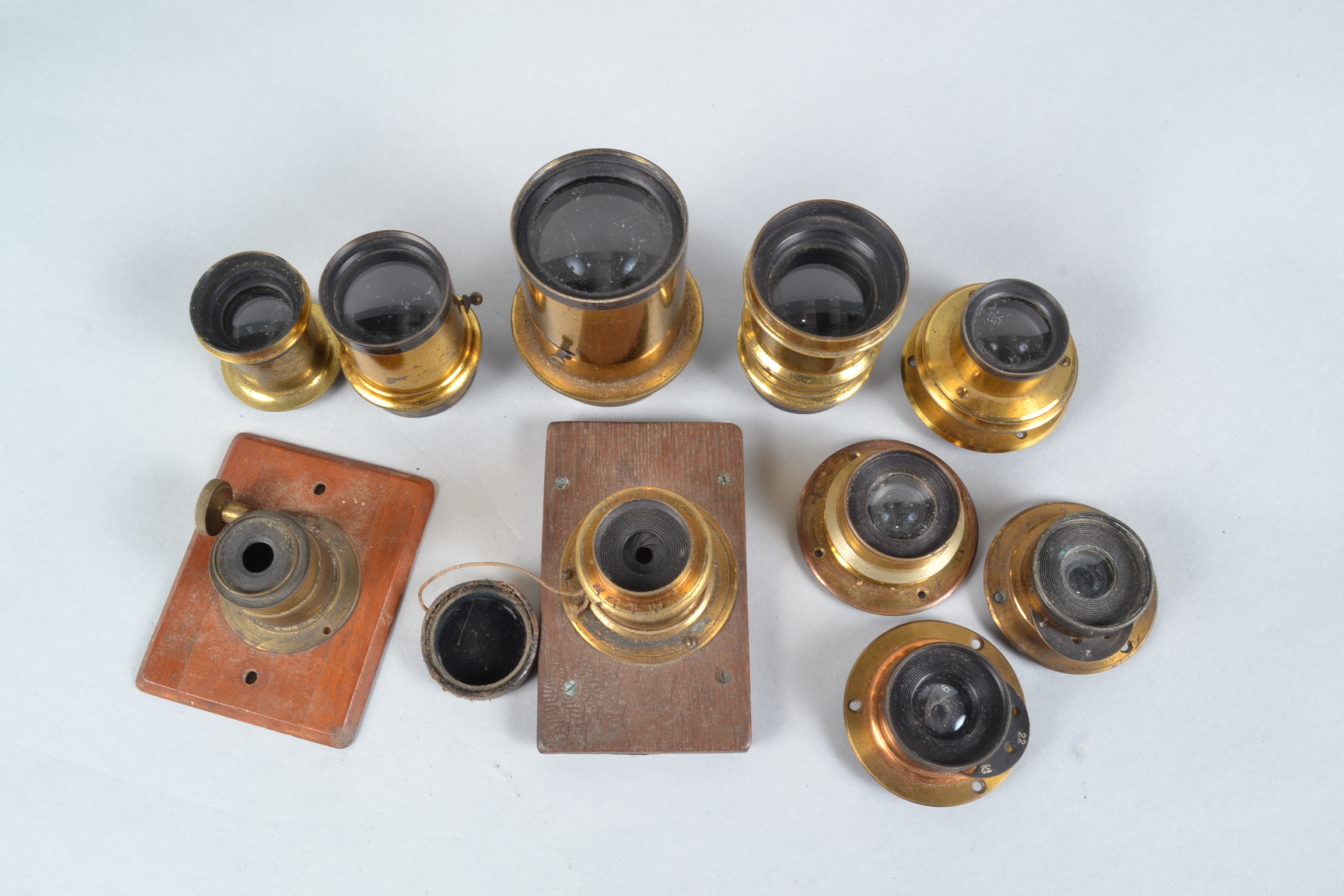 Ten Various Brass Lenses, including a Dallmeyer 5 x 4 Rapid Rectilinear lens, a Ross No 2 W.A.