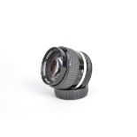 A Nikon Nikkor 85mm f/2 AI-S Lens, serial no 292000, barrel F, dent to filter ring, elements F-G,